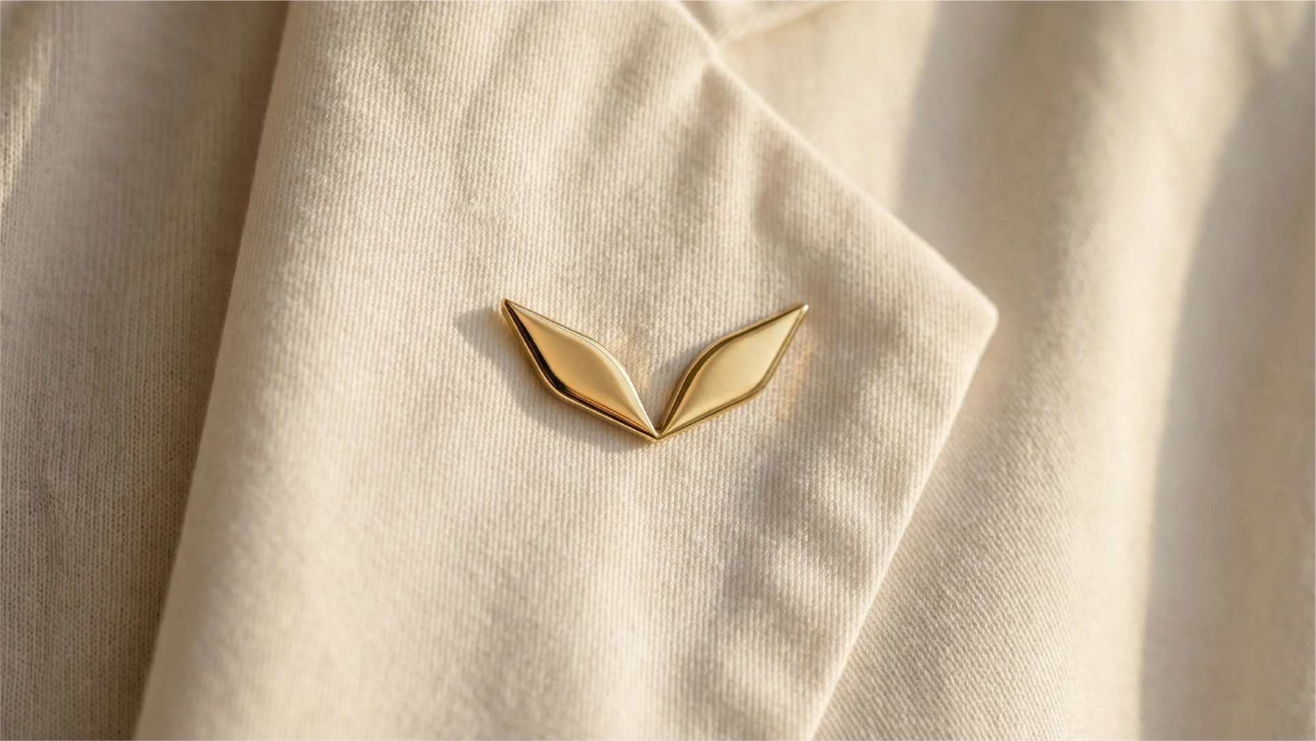 Gold Livser pin on a blazer