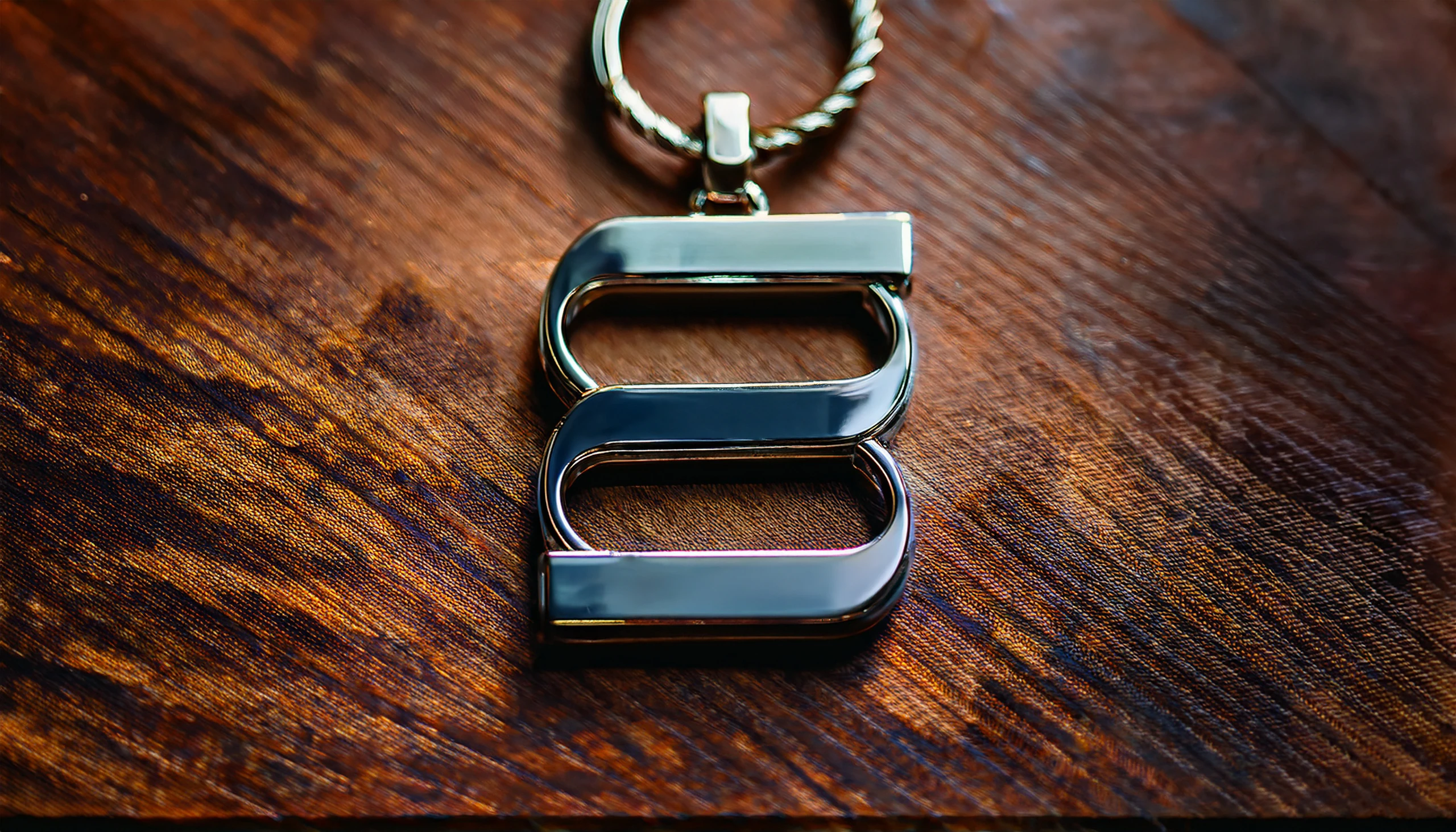 Metal keychain with the Megah symbol